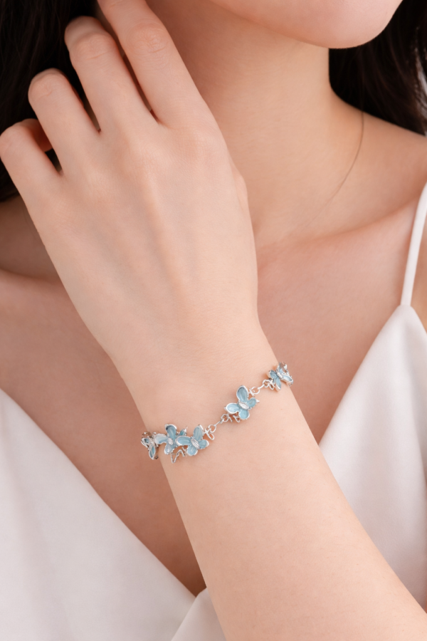 Delicate Blue Butterfly Charm Bracelet — a graceful and feminine jewelry piece designed to add elegance, color, and charm to your everyday style.