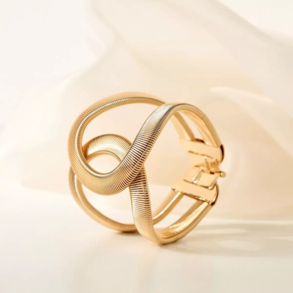 Elegant Gold Twist Cuff Bracelet — a modern statement jewelry piece featuring a unique wave design that blends sophistication with contemporary style.