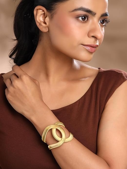 Elegant Gold Twist Cuff Bracelet — a modern statement jewelry piece featuring a unique wave design that blends sophistication with contemporary style.